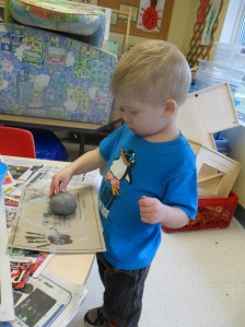 Exploring a ball of clay.